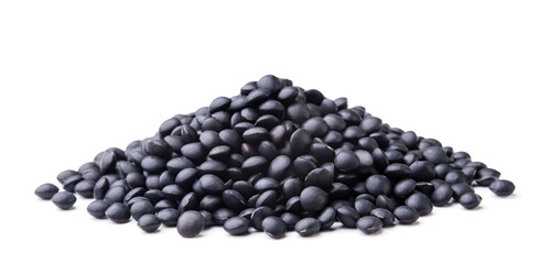 Heap of black lentils close-up on a white background. Isolated