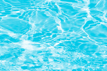 Blue water with ripples on the surface. Defocus blurred transparent blue colored clear calm water...