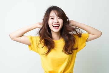 Fototapeta premium Happiness Asian Woman In Yellow Tshirt On White Background