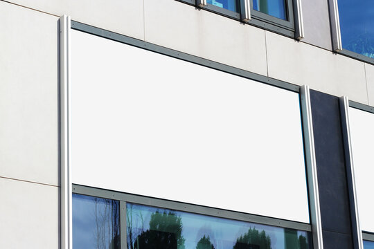 Large billboard banner on a storefront mock-up template, blank white restaurant or shop sign mockup.