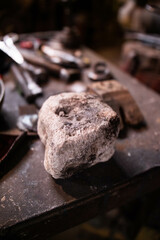 Stone on the table in the blacksmith's workshop