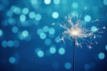 new year concept. sparklers and snow on blue background .
