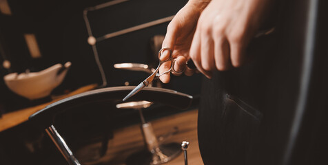 Vintage old barbershop banner, hairdresser salon barber shop for man, warm toning. Hand with scissors