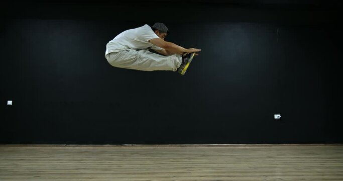 Super slow motion free running acrobat in the gym shot on 300fps 4K