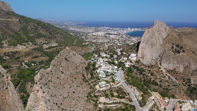 Aerial footage of summer holiday destination, Altea Hills, gated community in Costa Blanca, Spain. Vacation rentals and villas with private pool. Spanish real estate on Mediterranean coast