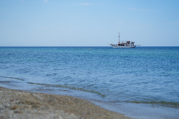 boat with tourists in the vicinity of the island of Thassos. landscape.