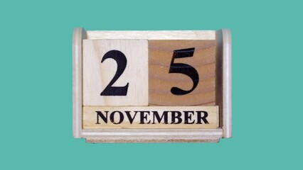 木製のカレンダーで11月30日から11月1日までをコマ撮りしたグリーンバックの動画