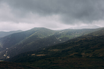 Morning foggy clouds in autumn mountain countryside. Ukraine, Transcarpathia.