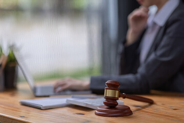 justice and law concept.business asian woman or lawyer or accountant working using a laptop at desk 