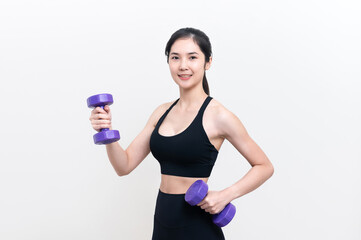 Asian woman wearing black workout clothes with smiling face Exercising with purple dumbbells with cheerfulness against a white background or isolated