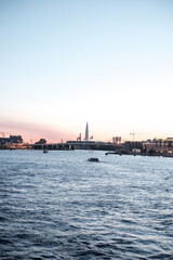 Naklejka premium The embankment of a beautiful wide river in a large ancient city.