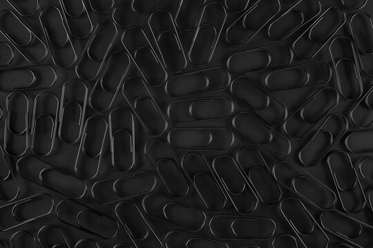 Black paper clips on black background.Solution for Business concepts.