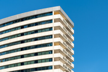 many windows and walls facade of a modern skyscraper without people