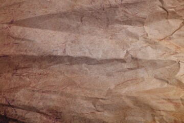 Texture of crumpled parchment paper as background, top view