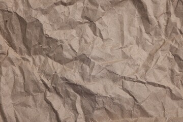 Texture of crumpled parchment paper as background, top view