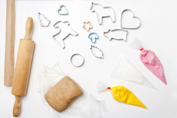 gingerbread dough and baking mold on white table. Christmas cookies on paper for baking. biscuits for New Year Celebration.