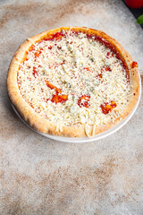 raw pizza four cheeses parmezan, mozzarella, emmental, cheddar, tomato sauce fast food appetizer meal food snack on the table