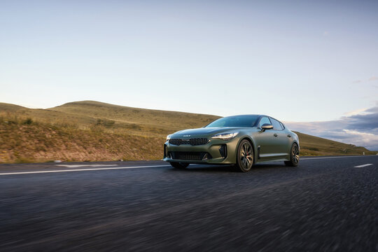 PRAGUE, CZECH REPUBLIC - SEPTEMBER 05, 2023: Kia Stinger GT green, car on the road