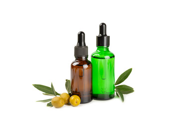 Olive essential oil. Glass bottle with olive oil isolated on a white background. Cosmetic oil.