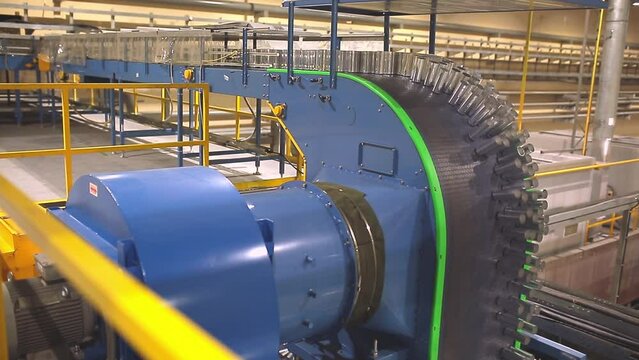 Conveyor line with the production of aluminum cans. Production of aluminum cans for drinks. Plant of high-tech equipment for the food industry.