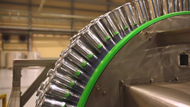 Conveyor line with the production of aluminum cans. Production of aluminum cans for drinks. Plant of high-tech equipment for the food industry.