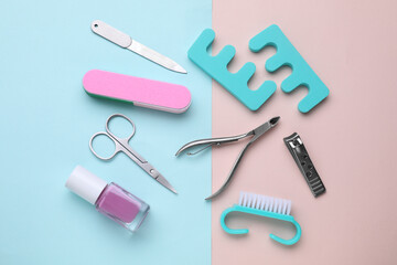 Set of pedicure tools on color background, flat lay
