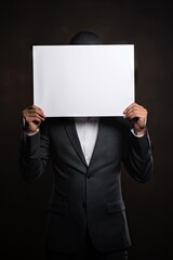 A man holding a blank sign in front of his