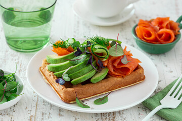 smoked salmon, avocado and cucumber waffle sandwich