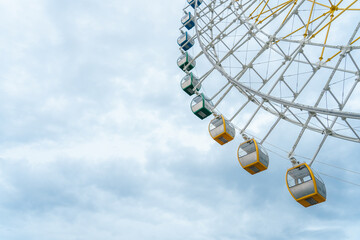 Ferris wheel against the blue sky. Modern Ferris wheel.