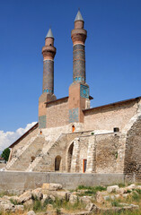Fototapeta na wymiar Double Minaret Madrasah was built in 1271 İlhanlı period. The tile decorations on the minarets are remarkable.