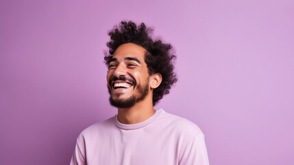 Happy joyful smiling young man looking aside up thinking of new good opportunities, dreaming, feeling inspired and proud standing isolated on purple background. - obrazy, fototapety, plakaty