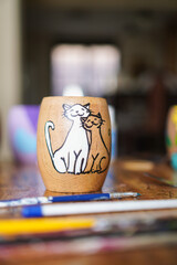 typical argentinian mate with a cat painting