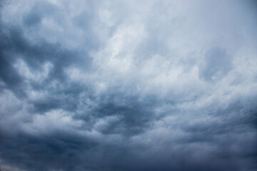 dark stormy sky, dark clouds, dark sky with converging heavy clouds and violent storm before rain,...