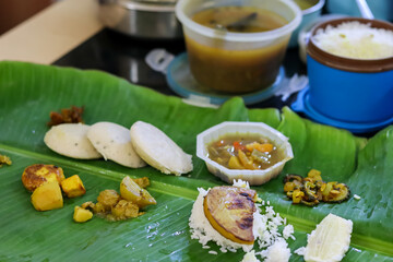 Office Lunch in Tiffin Boxes with Green Banana Leaf