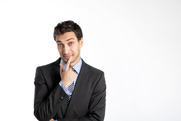 Handsome and interesting businessman in black suit thinking isolated on white background