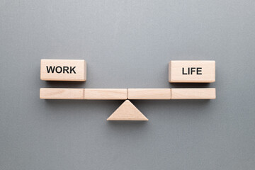 Work - Life balance on the beam symbol set by gemetry wood blocks on gray background