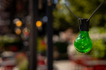 green light bulb as decoration in restaurant