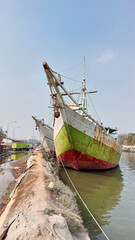 Fototapeta premium Sunda Kelapa old Harbour with fishing boats, ship and docks in Jakarta, Indonesia