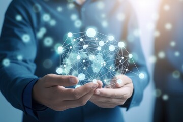 A man wearing a blue shirt is holding a sphere made up of connected dots. This image can be used to represent technology, connectivity, network, communication, or innovation.