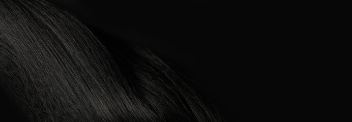 Close-up view of natural shiny dark hair, bunch of black brunette curls background