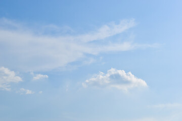 beautiful blue sky and white fluffy group of clouds with sunrise in the morning, natural background