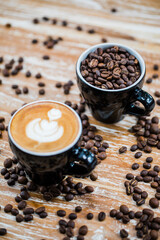latte art coffee and coffee beans on table