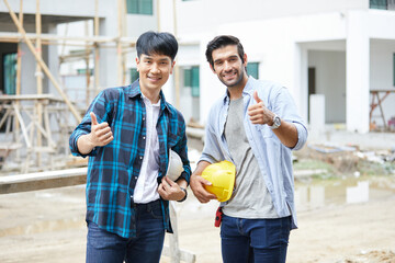 portrait workers or architect smiling and thumbs up pose at construction site