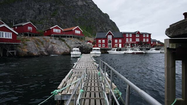 The Lofoten islands in Norway. Wooden mooring for boats red traditional houses lofoten