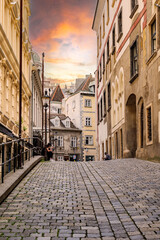 Vienna, Austria. View of the characteristic Greek quarter and Griechengasse street with the sunset sky. Vertical image. 2023-08-02.