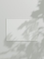 Minimal picture poster frame mockup on white wallpaper with leaf shadow