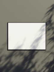 Blank frame mockup hanging on the wall with leaf shadow