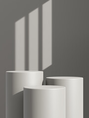 Empty gray podium or pedestal display on gray shadow background with cylinder stand concept