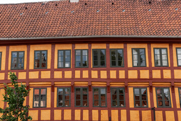 Facade of the half-timbered building with many windows