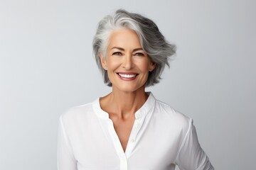 Fototapeta premium Beautiful model woman with grey hair isolated grey background